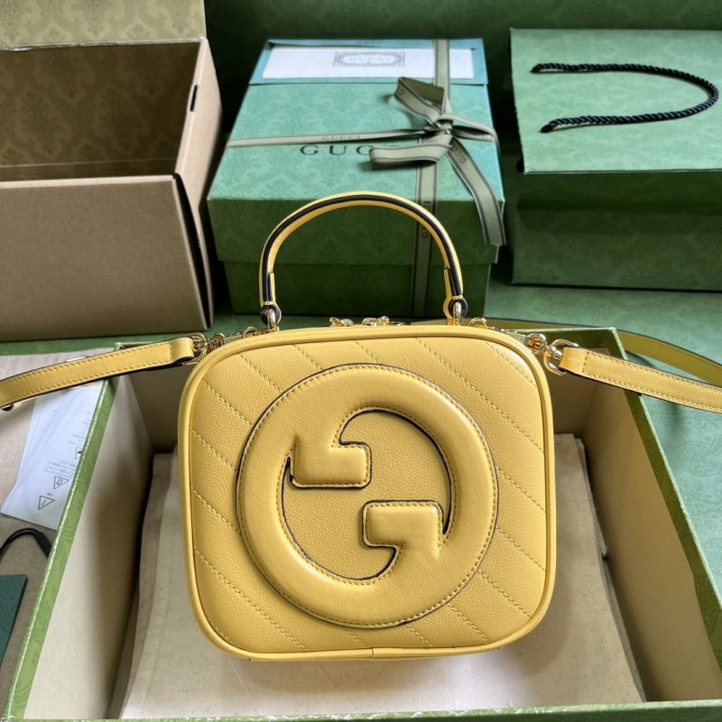 G*u*i top handle bags
